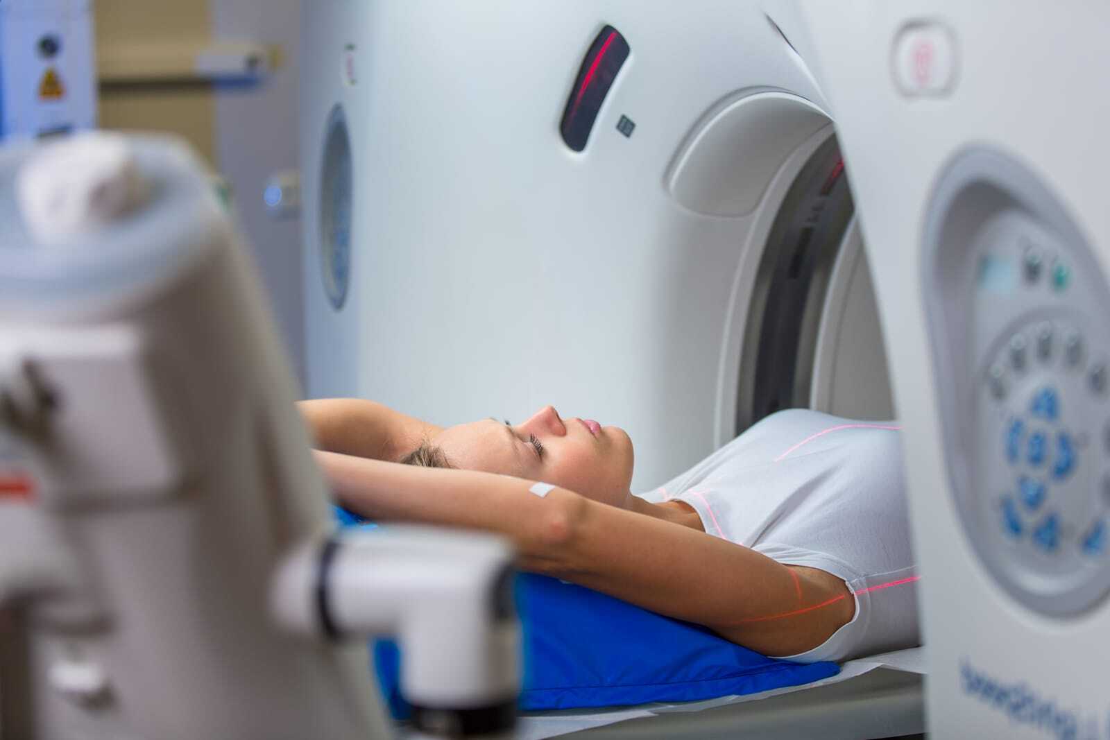 Patient lying on a CT scanner table during a CT scan